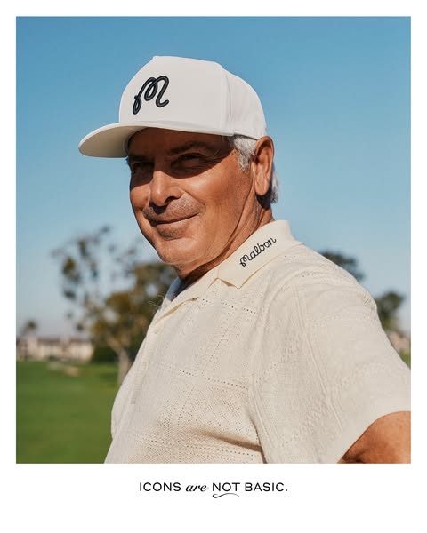 An advertisement featuring a man wearing Malbon brand clothing, specifically a hat and polo shirt, emphasizing a blend o