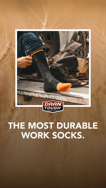 The ad features Darn Tough socks for work, emphasizing their durability. It shows a person putting on the socks with a b