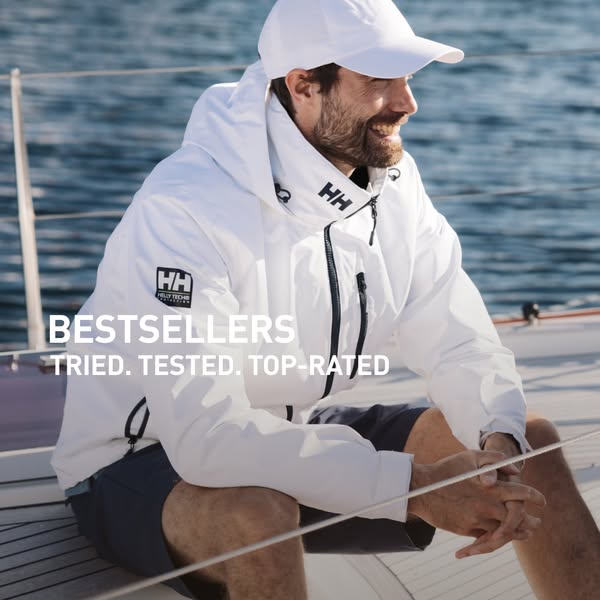 This ad promotes Helly Hansen's best selling gear by showcasing a man wearing a white jacket on a sailboat.