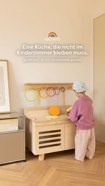 This ad for Grimms wooden toy kitchen shows the back of a young child playing with it, highlighting the aesthetic qualit