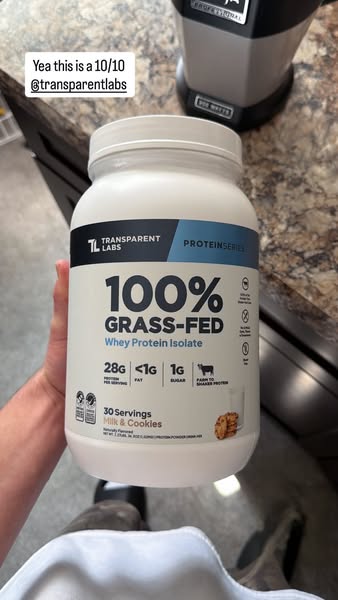 This ad features a person holding a container of Transparent Labs 100% Grass-Fed Whey Protein Isolate in the Milk & 