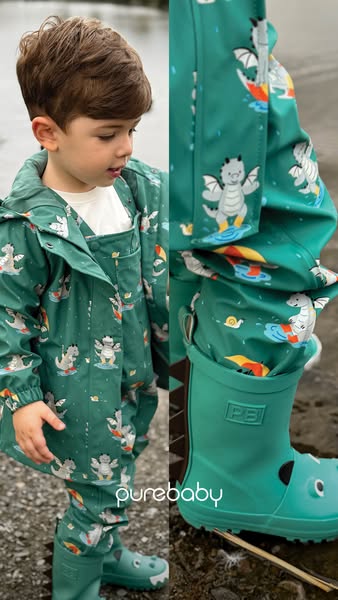 The ad features a young boy wearing a Purebaby-branded raincoat, overalls, and rainboots. The rain gear is a deep green 