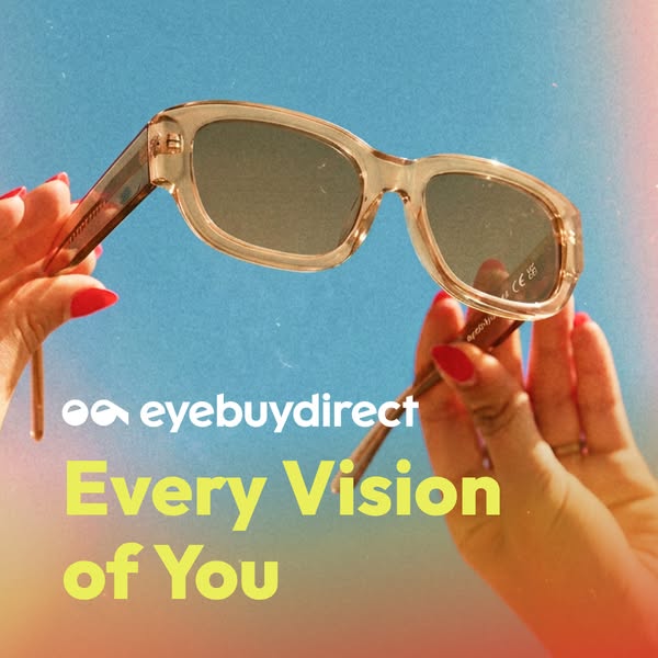 This image ad features a pair of sunglasses held up against a blue sky backdrop. The ad is meant to showcase the brand&#