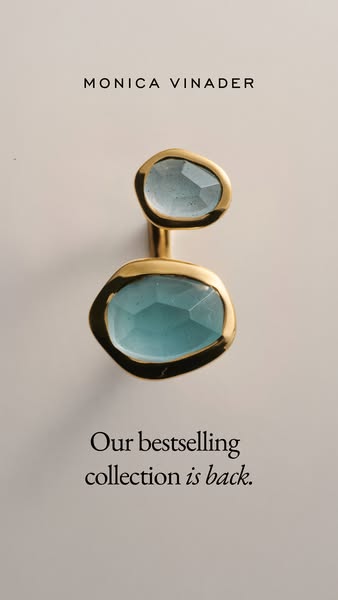 This image ad for Monica Vinader features a ring with two blue gemstones on a beige background. The headline indicates t