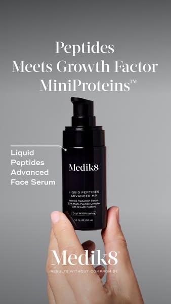 This image ad for Medik8 promotes their Liquid Peptides Advanced Face Serum. The image features a person holding the pro