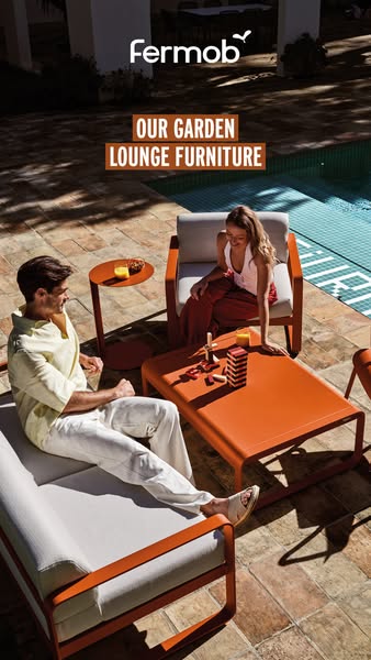 An ad for Fermob garden lounge furniture showcases a stylish outdoor setting with a couple enjoying the brand's furn