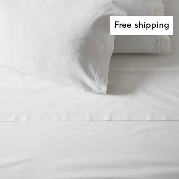 This ad features a close-up of white bedsheets and a pillow, promoting free shipping.