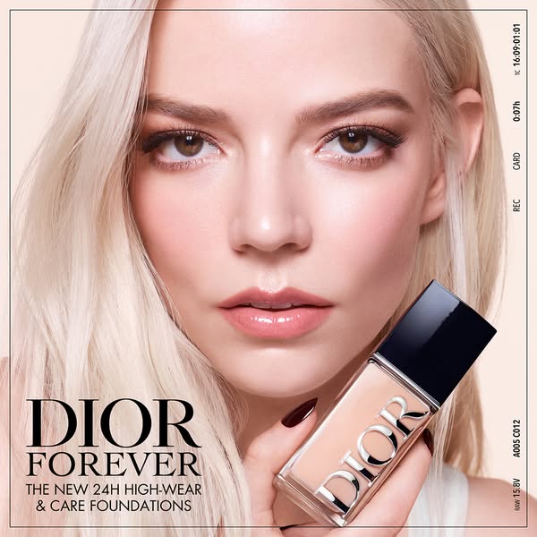 This ad features a close-up of a model holding Dior Forever foundation. The ad highlights the product's 24-hour high