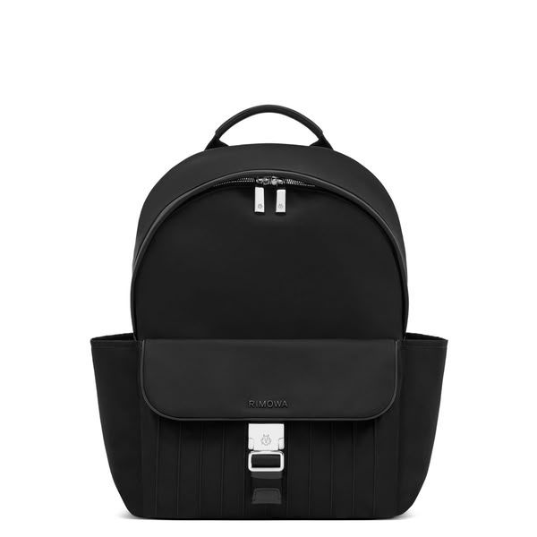 This ad showcases a black RIMOWA backpack against a white background.