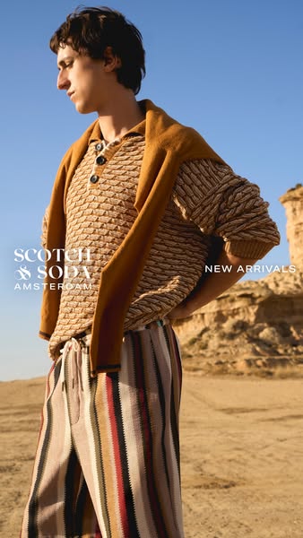 A single image ad shows a man modeling new arrivals from Scotch & Soda. The ad has a backdrop of a desert. The man i
