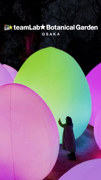 This ad promotes the teamLab Botanical Garden in Osaka, Japan, showcasing its immersive art experience with glowing, ove