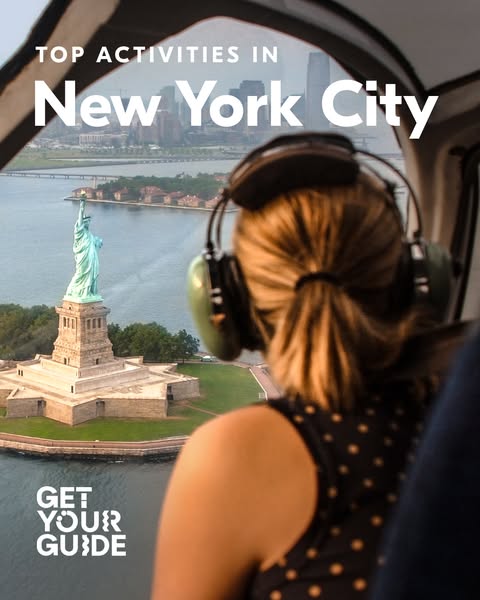 This image ad for GetYourGuide promotes top activities in New York City, featuring a view of the Statue of Liberty from 