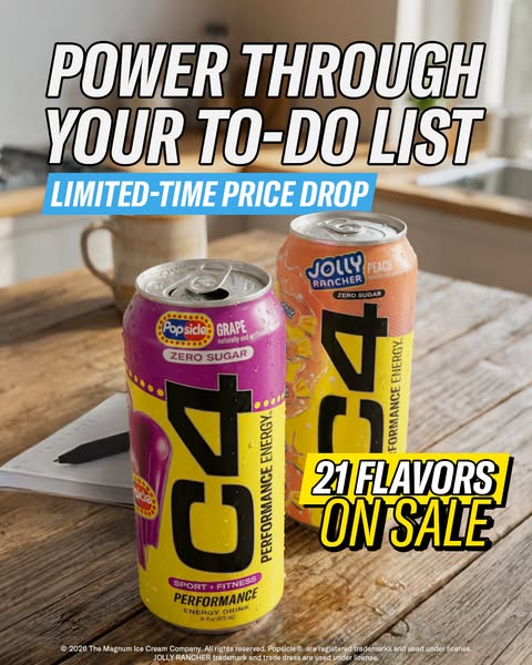 An image ad promoting C4 Energy drinks. Two cans are prominently displayed against the backdrop of a kitchen setting. Th
