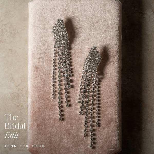 This image ad showcases Jennifer Behr's 'Bridal Edit' collection. The ad features a close-up studio shot of