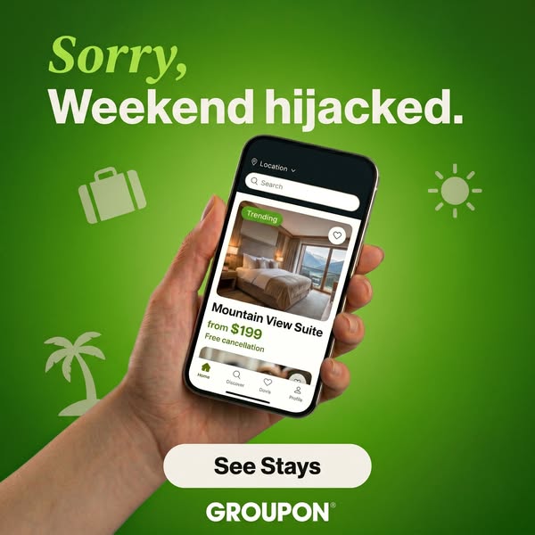 The ad depicts a hand holding a phone displaying the Groupon app to show a hotel suite for a weekend getaway to combat t