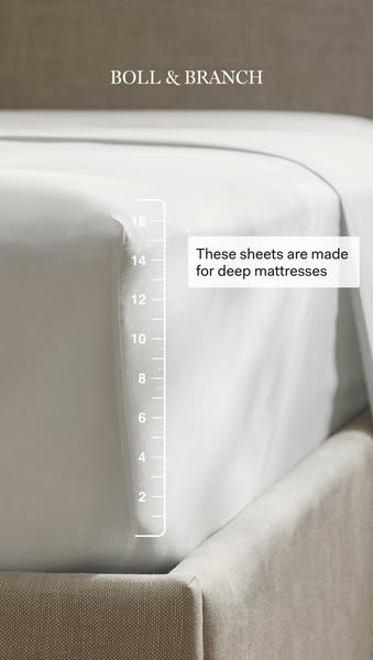 This ad from Boll & Branch showcases the deep pocket sheets made for deep mattresses.