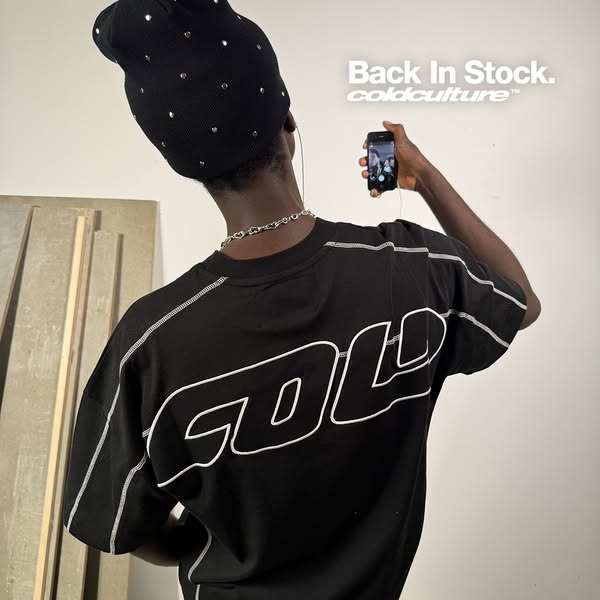 This ad features a person wearing a black t-shirt with the brand name on the back, along with a black beanie. The ad ind