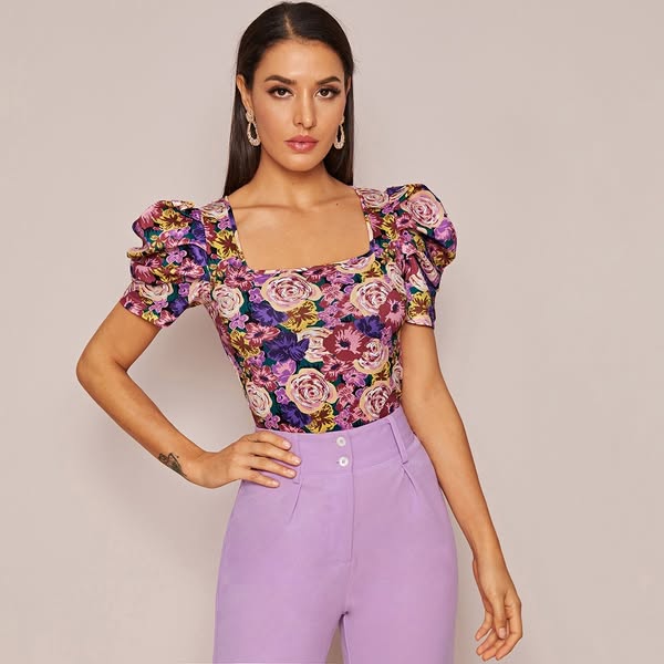 This ad features a woman wearing a floral top and lavender pants. The ad is likely for a clothing brand.