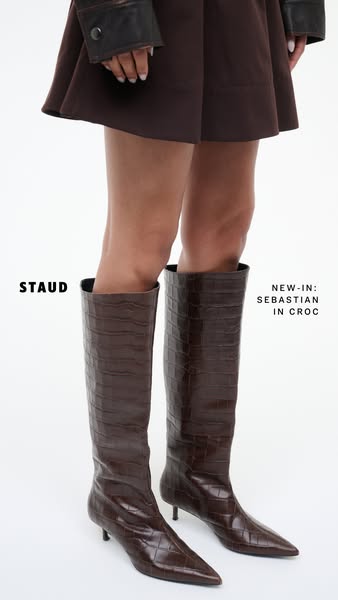 This ad showcases the new Sebastian in Croc boots from STAUD. The ad features a model wearing the boots with a brown dre