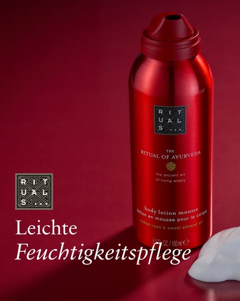 This ad features a red bottle of Rituals body lotion mousse against a matching red background, emphasizing the product&#