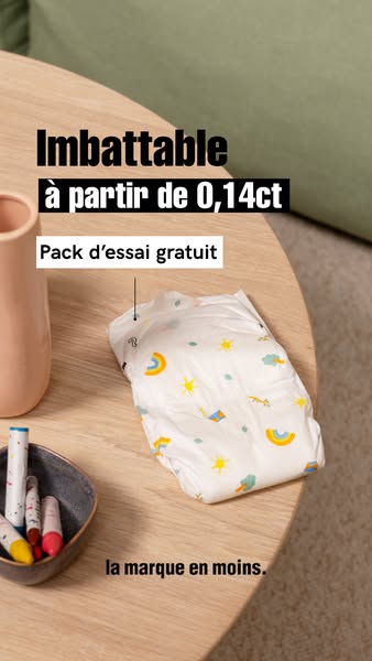 The ad showcases the diaper's features, particularly its thinness and the availability of a free trial pack, aimed a