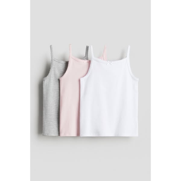 This ad showcases a set of three camisoles in different colors, emphasizing their simplicity and versatility.