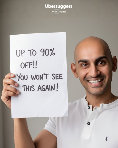 This image ad for Ubersuggest features a man holding a sign advertising a limited-time offer of up to 90% off.
