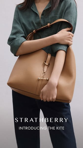 This ad showcases the Strathberry Kite handbag, highlighting its design and style.