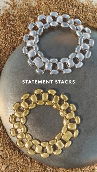 An image ad displaying two chunky, geometric bracelets from the brand OPPOSITE.