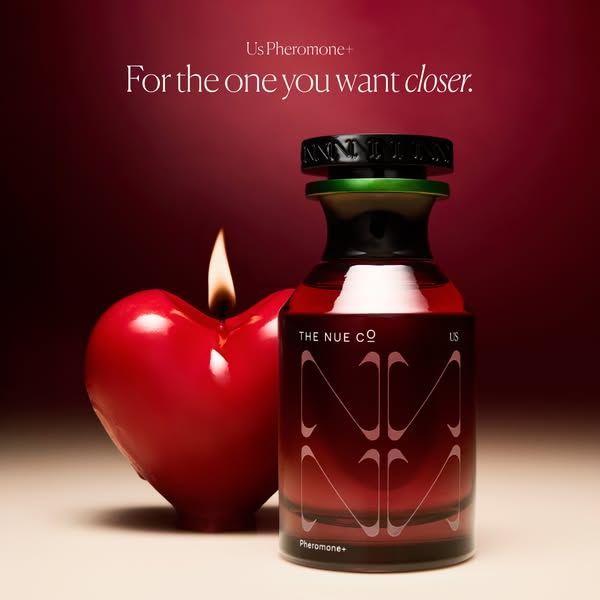 This ad showcases the The Nue Co US Pheromone+ in front of a heart shaped candle and encourages users to get it for the 