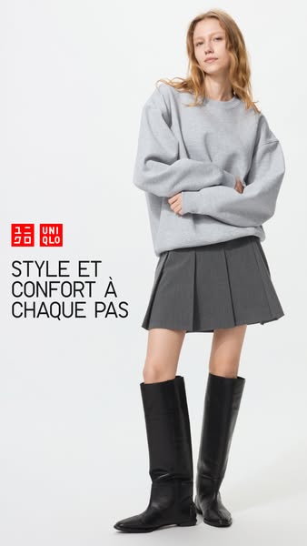 This image ad for Uniqlo features a model wearing a coordinated outfit including a gray sweatshirt, gray skirt, and blac