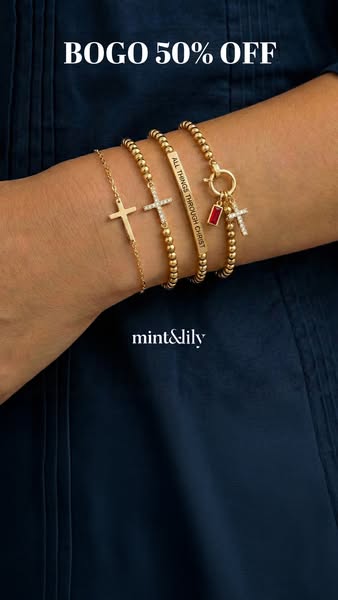 This image ad promotes Mint & Lily jewelry with a BOGO 50% off deal. It features a close-up shot of a woman's ar
