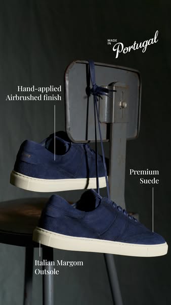 This image ad showcases a pair of blue suede sneakers, highlighting their premium materials and construction details. Th