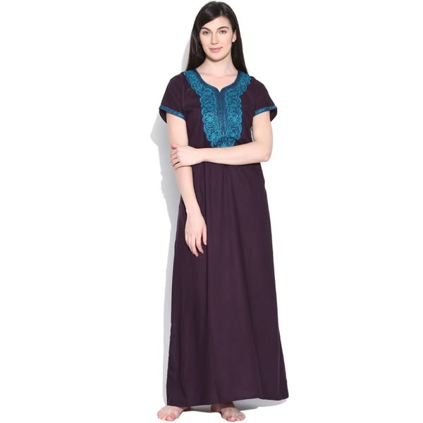 This ad features a woman wearing a long, dark purple nightgown with blue embroidery around the neck and chest. It appear