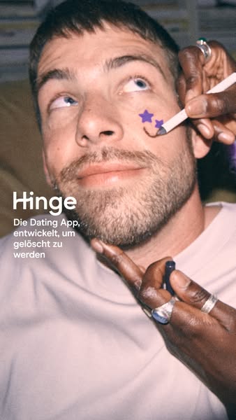 This Hinge ad features a man getting his face painted with purple stars. The ad copy states that Hinge is the dating app