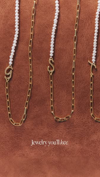 An image ad that showcases a brand of jewelry. The jewelry is laid out against a brown background and the headline reads