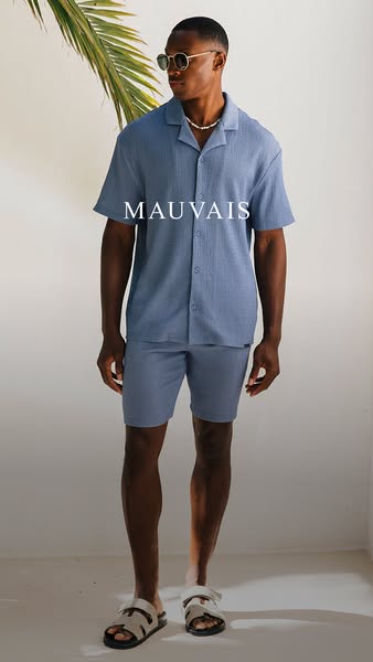 An image showcasing a matching shirt and shorts set from Mauvais. The ad emphasizes a modern and relaxed style.