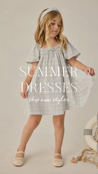 The ad is for summer dresses. A young girl is modeling a summer dress.