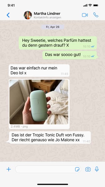 This ad presents a screenshot of a text message conversation where one person asks about a perfume another person was we