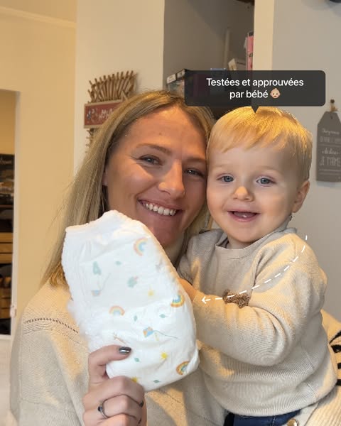 This ad features a mother holding her child, who is wearing the advertised diaper. The ad includes a testimonial about t