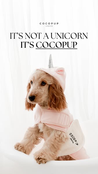 This image ad showcases a dog wearing a pink unicorn-themed bathrobe from Cocopup London, emphasizing the brand's un