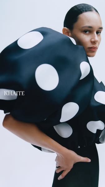 This ad features a high fashion garment and focuses on the unique design of the garment.
