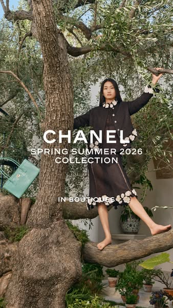This image ad for Chanel features a model posed in an olive tree, wearing items from the brand's Spring Summer 2026 