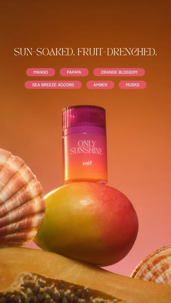 The ad showcases the Snif Only Sunshine perfume by showing the product balanced atop a mango on top of a sliced papaya, 