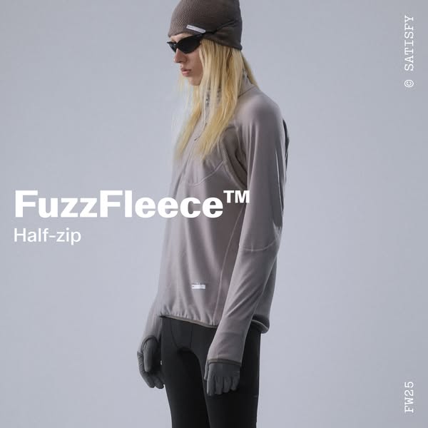 This ad features a person wearing a FuzzFleece™ Half-zip top from Satisfy. The ad highlights the product's design an