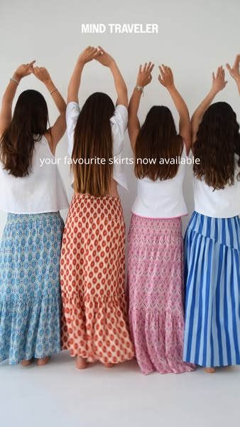 This image ad features four women posing with their arms in the air wearing four different maxi skirts. The ad promotes 