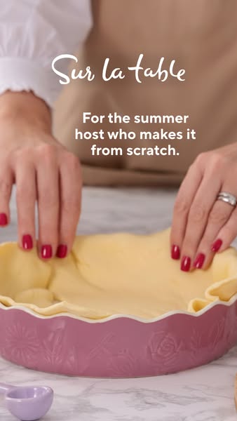 This ad for Sur La Table shows a woman using their pie dish in the kitchen. The advertisement uses the copy to speak to 