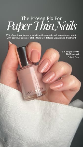 This image ad for Static Nails features a close-up of a hand holding a bottle of the brand's 5-in-1 Rapid Growth Nai