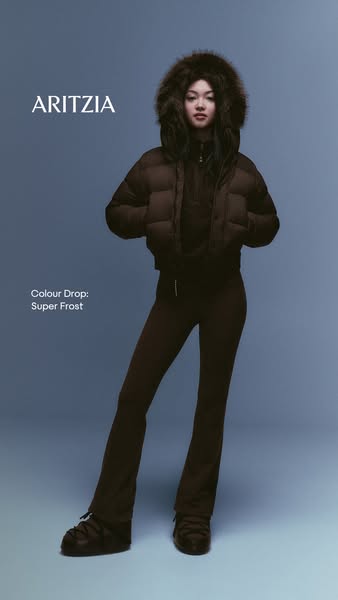 This ad showcases Aritzia's Super Frost color drop, featuring a model wearing a puffer jacket, pants, and shoes in t