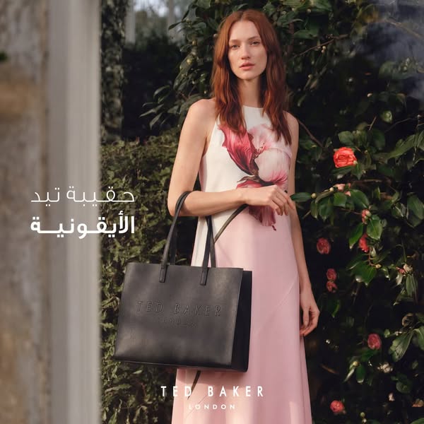 This ad displays a black Ted Baker London tote bag held by a model. The text in the ad references a Ted Baker bag and is